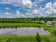 Enjoy a calming view from the backyard overlooking the beautiful pond surrounded by lush landscaping at 8119 Trimbelle Ter, Parrish, FL 34219
