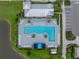 Aerial view of the community pool featuring ample seating, shaded cabanas, and lush landscaping at 8119 Trimbelle Ter, Parrish, FL 34219
