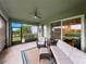 Enclosed lanai features comfortable seating and serene views, perfect for relaxation at 8119 Trimbelle Ter, Parrish, FL 34219