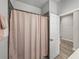 Bathroom shower featuring gray tile and a pink shower curtain at 8119 Trimbelle Ter, Parrish, FL 34219