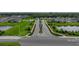 A tranquil street view showcasing well-maintained homes, manicured lawns, and a peaceful neighborhood setting at 8119 Trimbelle Ter, Parrish, FL 34219