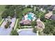 Bird's eye view of a community pool and playground with parking in a landscaped neighborhood at 828 Terra Vista St, Brandon, FL 33511
