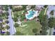 Aerial view of community pool, playground, park, and well-manicured green spaces for active outdoor living at 828 Terra Vista St, Brandon, FL 33511