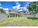 Large, well-maintained backyard with a privacy fence, showcasing ample space for recreation at 828 Terra Vista St, Brandon, FL 33511