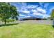 Expansive backyard with lush green grass and a white fence, perfect for outdoor activities at 828 Terra Vista St, Brandon, FL 33511