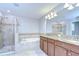 Bathroom featuring a tiled shower, a soaking tub, and a vanity with double sinks at 828 Terra Vista St, Brandon, FL 33511