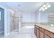Bathroom with a tiled shower, soaking tub, and double sink vanity at 828 Terra Vista St, Brandon, FL 33511