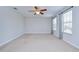 Large bedroom with carpet, ceiling fan, and natural light from big windows at 828 Terra Vista St, Brandon, FL 33511