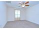 Bright bedroom with neutral carpet, ceiling fan, and natural light from the window at 828 Terra Vista St, Brandon, FL 33511