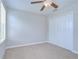 Nicely carpeted bedroom with neutral walls, ceiling fan and closet at 828 Terra Vista St, Brandon, FL 33511