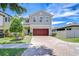 Charming two-story home boasts a brick driveway and a well-maintained landscaped yard at 828 Terra Vista St, Brandon, FL 33511