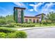 Attractive clubhouse exterior with stone accents, landscaping and a parking lot at 828 Terra Vista St, Brandon, FL 33511