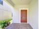 Inviting front entrance with a covered porch and brick pavers leading to the front door at 828 Terra Vista St, Brandon, FL 33511