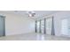 Spacious living room boasts lots of natural light and tiled floors and neutral-toned walls at 828 Terra Vista St, Brandon, FL 33511
