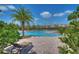 Community pool with water features, palm trees, and lounge chairs, perfect for relaxation and recreation at 828 Terra Vista St, Brandon, FL 33511