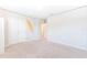 A Large bedroom with ample open space, carpeted floor, surfboard decor, and double door closet at 8305 Praise Dr, Tampa, FL 33625