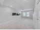 Large bonus room with a ceiling fan, recessed lighting, and multiple wall-mounted televisions at 8305 Praise Dr, Tampa, FL 33625