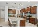 Modern kitchen with stainless steel appliances, granite countertops, large center island, and ample cabinet space at 8305 Praise Dr, Tampa, FL 33625