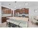 Modern kitchen featuring granite countertops, stainless steel appliances, and a large center island with seating at 8305 Praise Dr, Tampa, FL 33625