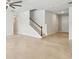 Spacious living room with tile floors, stairway and neutral walls, offering a bright and inviting atmosphere at 8305 Praise Dr, Tampa, FL 33625