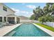 Backyard pool with a spa and expansive patio, perfect for outdoor entertaining and relaxation at 8305 Praise Dr, Tampa, FL 33625