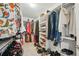 Well-organized walk-in closet with ample shelving and hanging space for efficient storage of clothing and accessories at 8305 Praise Dr, Tampa, FL 33625