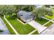 Aerial view of a home showing a lush green lawn and a large driveway at 8901 Eagle Watch Dr, Riverview, FL 33578