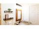 Bright bathroom with a framed mirror, granite countertop, and shelves for decor at 8901 Eagle Watch Dr, Riverview, FL 33578