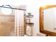 Well-lit bathroom featuring a shower and modern shelves perfect for decor and storage at 8901 Eagle Watch Dr, Riverview, FL 33578