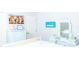 Bedroom with light blue furniture, decorative wall hangings, and a full-length mirror at 8901 Eagle Watch Dr, Riverview, FL 33578