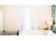Bedroom with window with flowing white curtains, and a decorative sitting bench at 8901 Eagle Watch Dr, Riverview, FL 33578