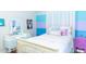 Fun bedroom with colorful striped wall, and vanity desk at 8901 Eagle Watch Dr, Riverview, FL 33578