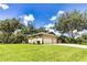 Charming exterior of a single-story home featuring a three-car garage and manicured landscaping at 8901 Eagle Watch Dr, Riverview, FL 33578