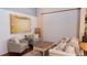 Cozy living room with stylish seating, hardwood floors, and a large colorful painting at 8901 Eagle Watch Dr, Riverview, FL 33578