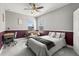 Comfortable bedroom featuring stylish decor, a desk area, and ample natural light at 9275 Bella Vita Cir, Land O Lakes, FL 34637