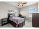 Bright bedroom with ceiling fan, carpet and ample natural light at 9275 Bella Vita Cir, Land O Lakes, FL 34637