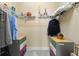 Walk-in closet featuring organized storage, shelving, and colorful drawer units at 9275 Bella Vita Cir, Land O Lakes, FL 34637