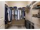Walk-in closet with custom shelving and ample storage space at 9275 Bella Vita Cir, Land O Lakes, FL 34637