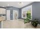 Dining area with a large window offering natural light and views of the backyard at 9275 Bella Vita Cir, Land O Lakes, FL 34637