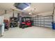 Spacious three car garage equipped with an electric golf cart at 9275 Bella Vita Cir, Land O Lakes, FL 34637
