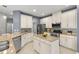 Beautiful kitchen features granite countertops, stainless steel appliances, and a center island at 9275 Bella Vita Cir, Land O Lakes, FL 34637