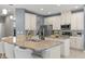 Kitchen with granite countertops, stainless steel appliances, and a breakfast bar at 9275 Bella Vita Cir, Land O Lakes, FL 34637
