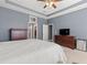 Spacious main bedroom with a ceiling fan and neutral decor at 9275 Bella Vita Cir, Land O Lakes, FL 34637