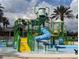Community water park featuring slides, sprayers, and water features offers fun water-based activities for residents at 9275 Bella Vita Cir, Land O Lakes, FL 34637