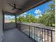 Covered balcony overlooking a screened pool and lush greenery, creating a private outdoor space at 9808 Milano Dr, Trinity, FL 34655