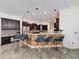 Gourmet kitchen featuring a breakfast bar with seating, custom cabinets, and modern stainless steel appliances at 9808 Milano Dr, Trinity, FL 34655