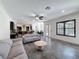Spacious living room that seamlessly connects to the kitchen and dining areas, perfect for gatherings at 9808 Milano Dr, Trinity, FL 34655