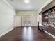 A spacious living room featuring dark wood floors and a custom built-in bar area at 9808 Milano Dr, Trinity, FL 34655