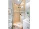 Charming bathroom featuring tile shower, vanity with storage and a framed mirror at 13710 Westshire Dr, Tampa, FL 33618