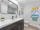 Modern bathroom featuring sleek vanity, contemporary mirror, and modern finishes at 13710 Westshire Dr, Tampa, FL 33618
